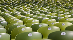 A group of numbered chairs in an auditorium.